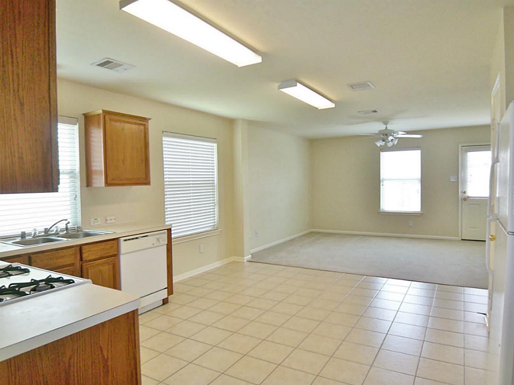 7335 Kransburg Ranch Drive Cypress, TX 77433 - Photo 7 of 21 Dining/Breakfast area. Tile floor. All White gas appliances.