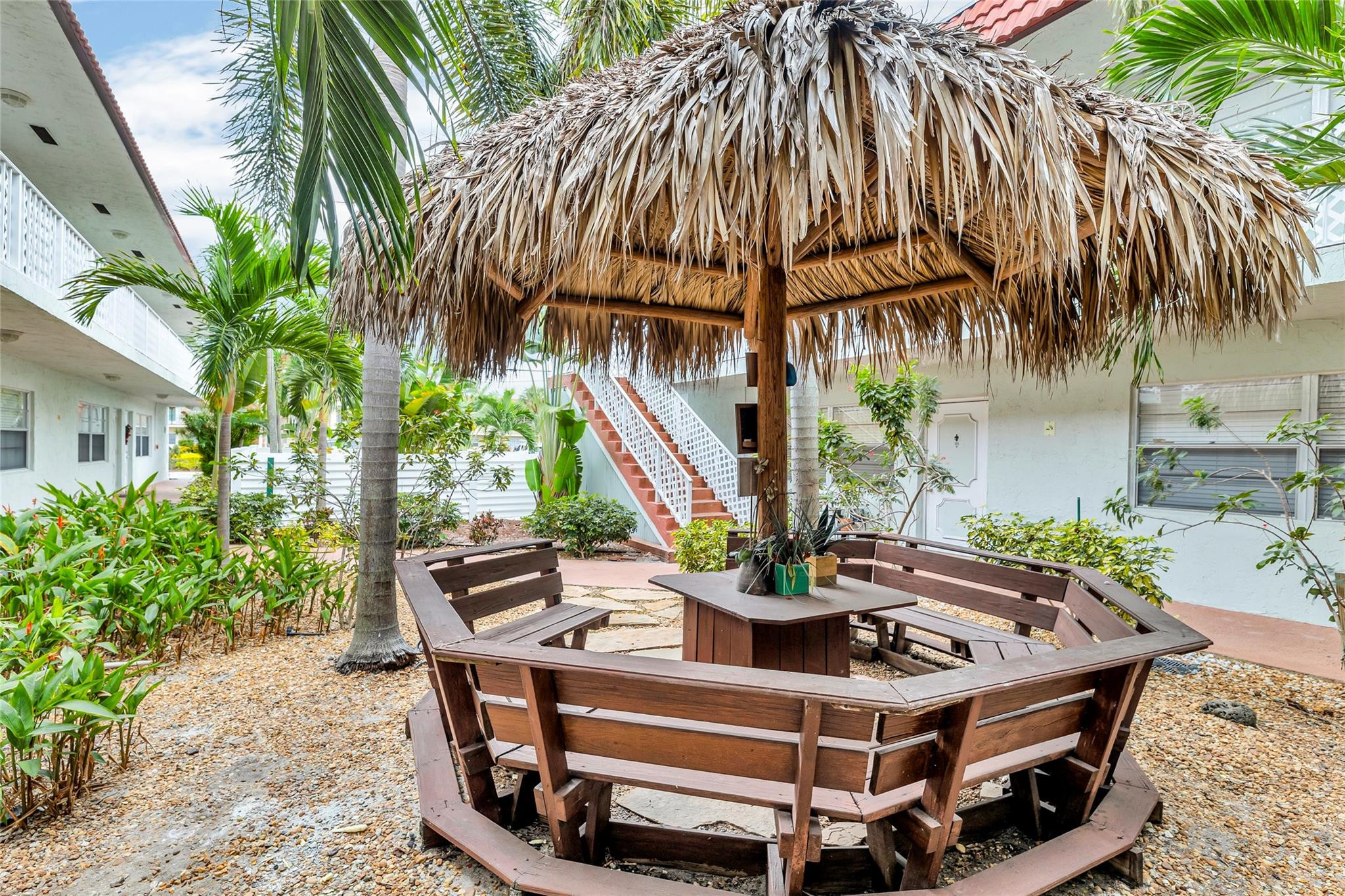 2201 Northeast 36th Street, Unit 207 Lighthouse Point, FL 33064 - Photo 28 of 35 Nice seating area offered in courtyard