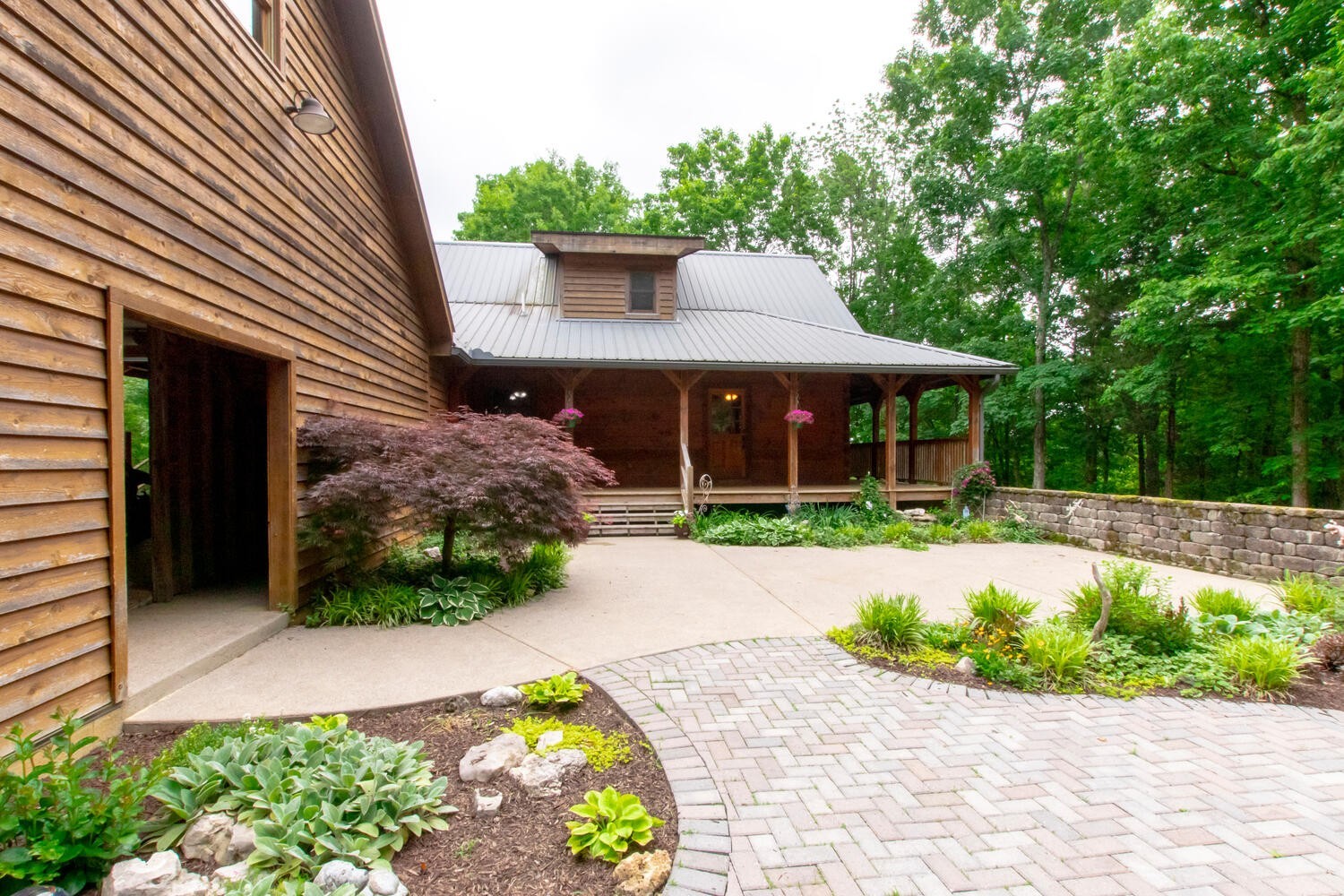 5359 Craddock Road Lascassas, TN 37085 - Photo 45 of 67 a front view of a house with a garden and porch