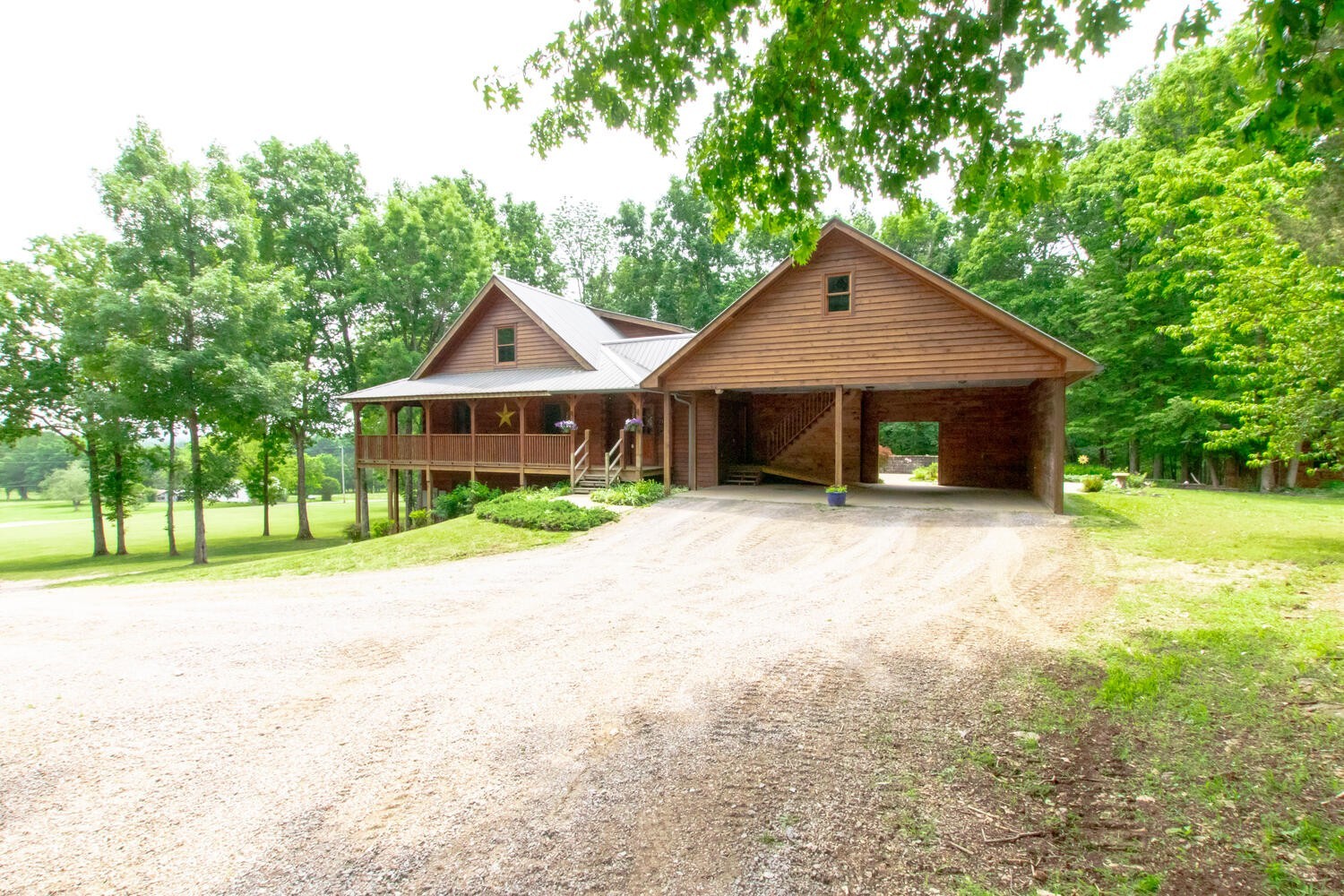 5359 Craddock Road Lascassas, TN 37085 - Photo 5 of 67 a front view of a house with a garden and trees