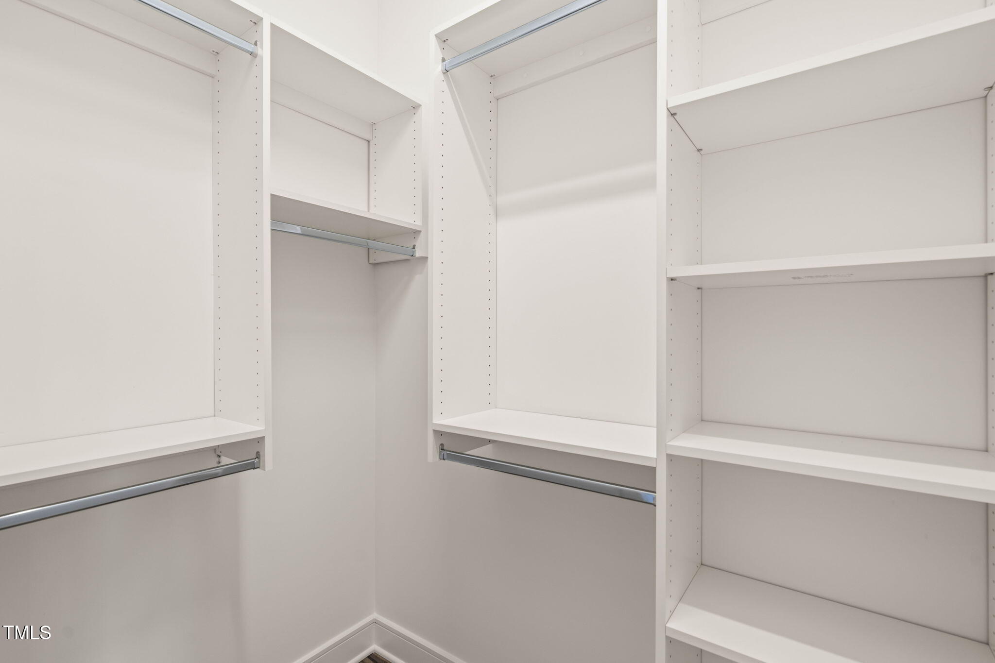 615 Daniels Street, Unit 215 Raleigh, NC 27605 - Photo 18 of 37 a view of an empty walk in closet