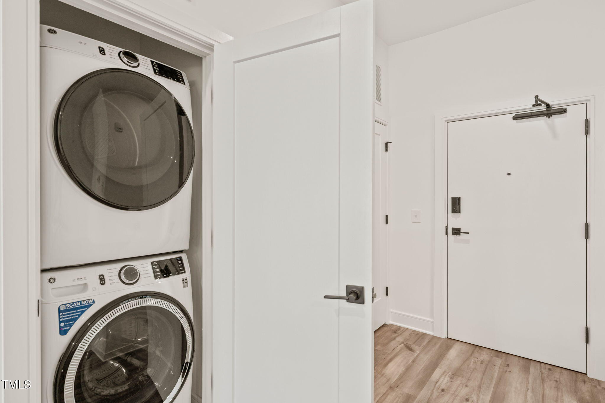 615 Daniels Street, Unit 215 Raleigh, NC 27605 - Photo 25 of 37 a view of a hallway with washer and dryer