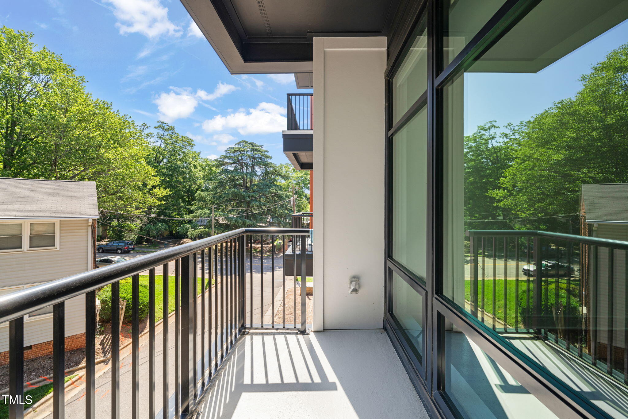 615 Daniels Street, Unit 215 Raleigh, NC 27605 - Photo 26 of 37 a view of a balcony with wooden floor