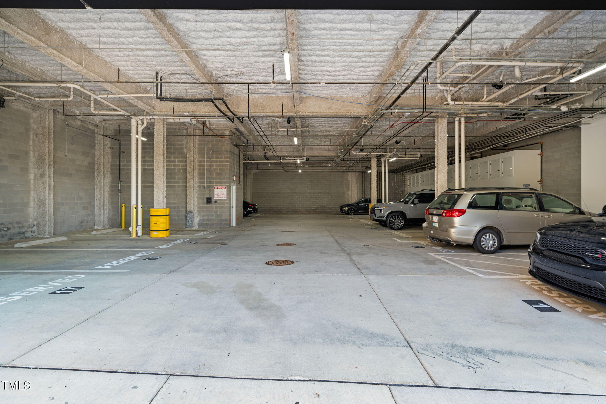 615 Daniels Street, Unit 215 Raleigh, NC 27605 - Photo 28 of 37 a view of parking area with parking space