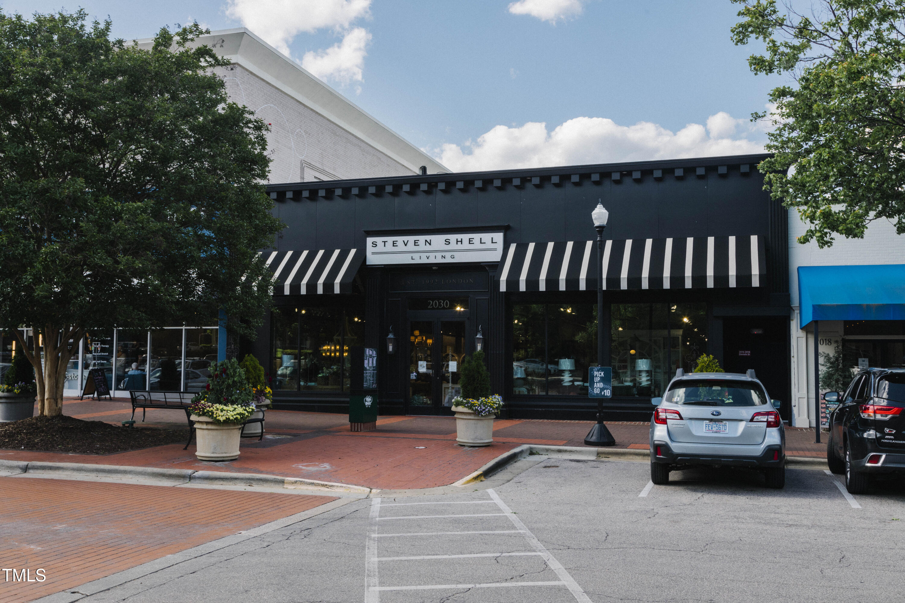 615 Daniels Street, Unit 215 Raleigh, NC 27605 - Photo 36 of 37 a car parked in front of building
