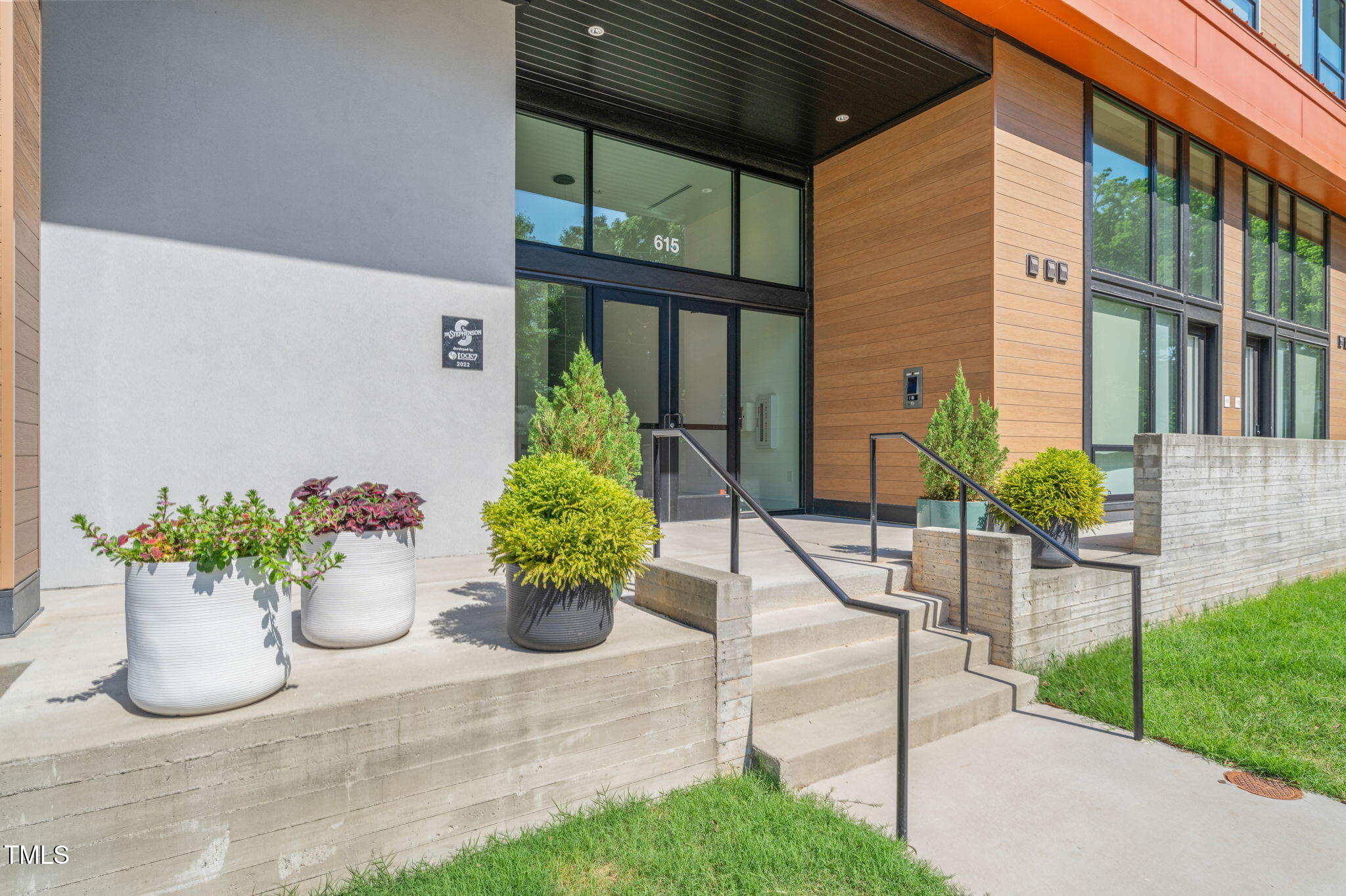 615 Daniels Street, Unit 215 Raleigh, NC 27605 - Photo 3 of 37 a view of a chairs and table in the garden