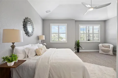 a bedroom with a bed and a couch