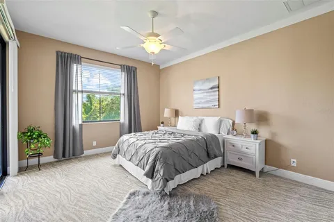 a room with a bed and a chandelier