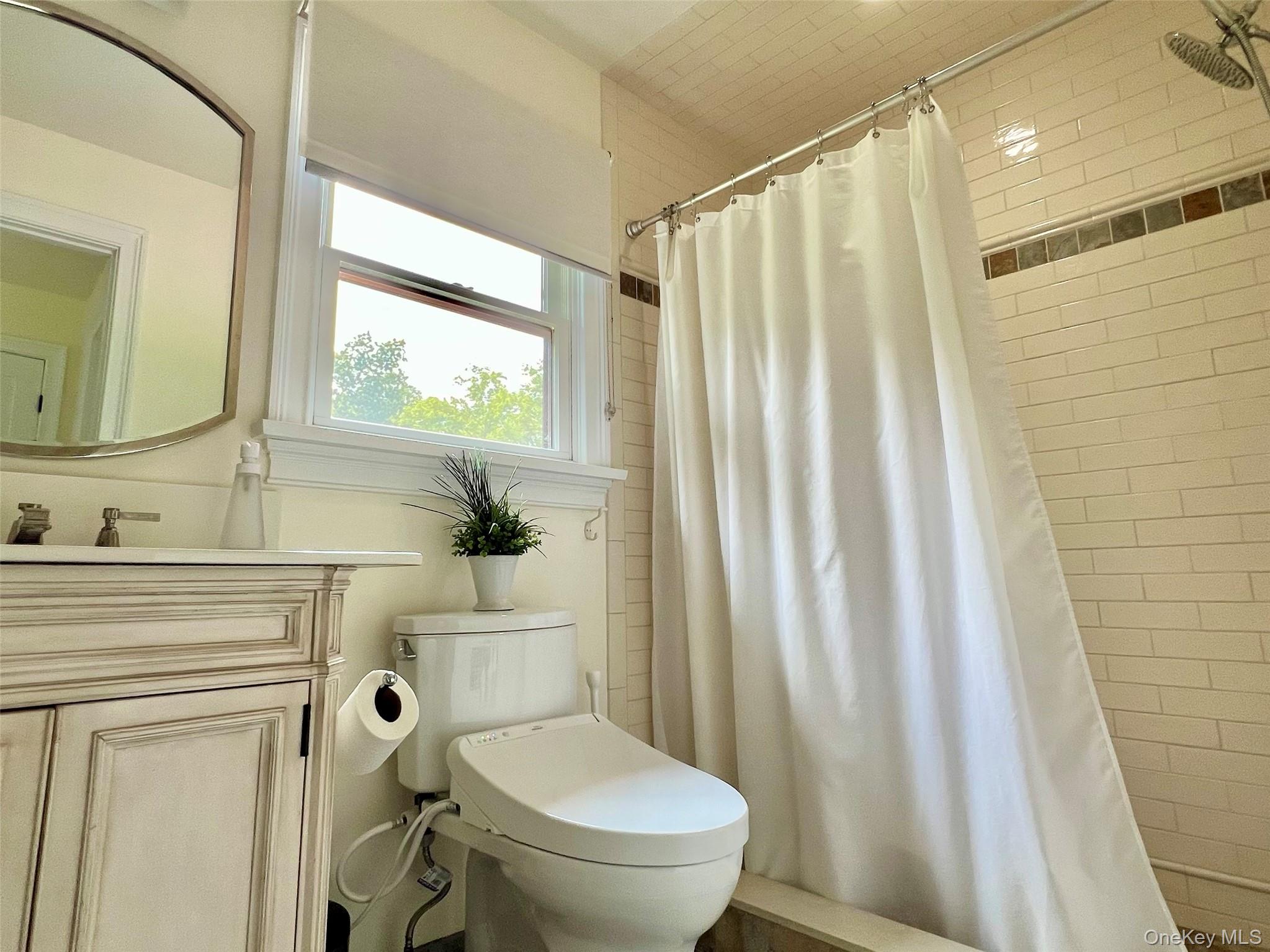 119 Mustato Road Katonah, NY 10536 - Photo 11 of 23 a bathroom with a sink a toilet and a mirror