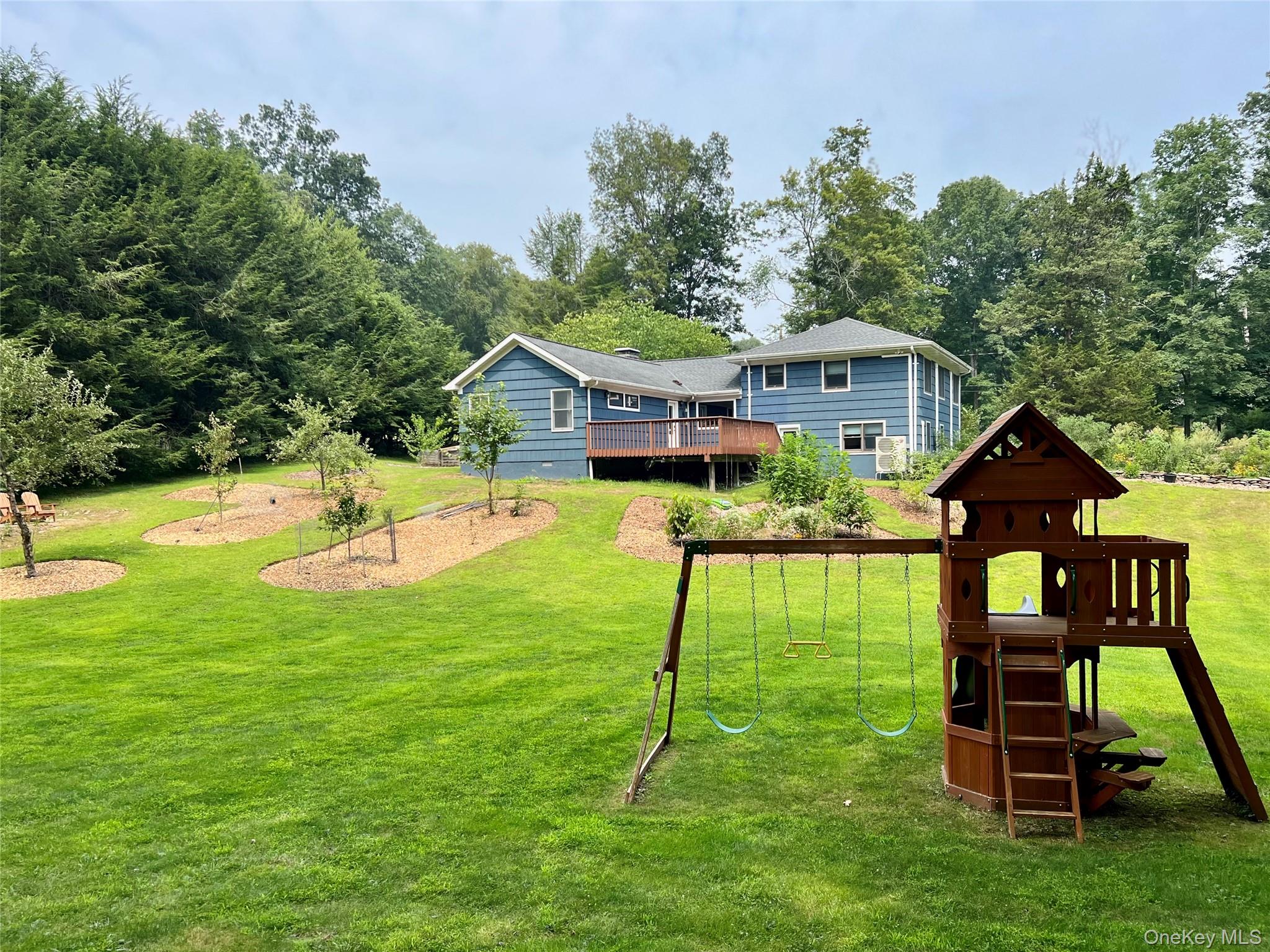 119 Mustato Road Katonah, NY 10536 - Photo 17 of 23 a view of a house with a yard porch and sitting area