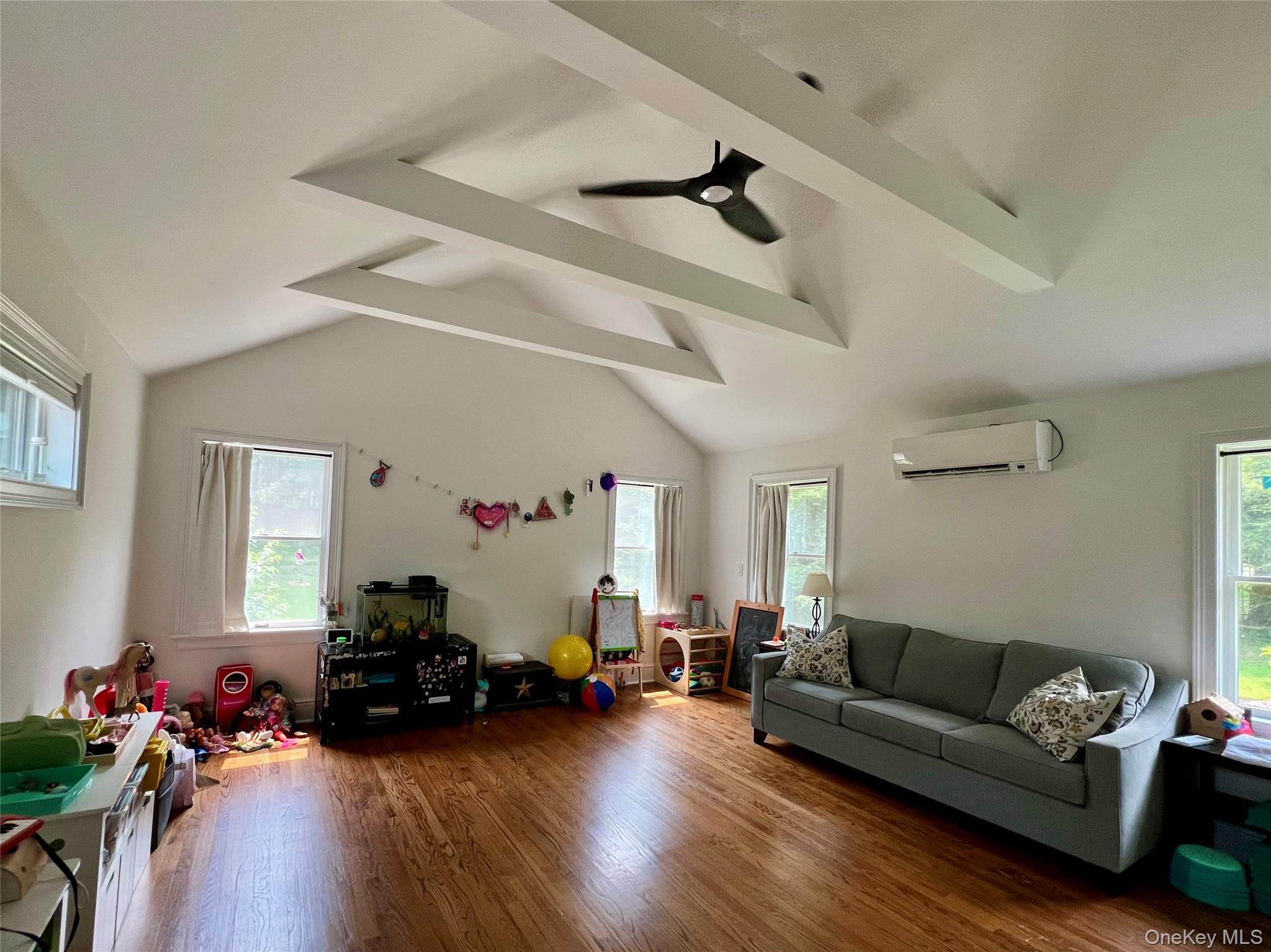 119 Mustato Road Katonah, NY 10536 - Photo 8 of 23 a living room with furniture and a wooden floor