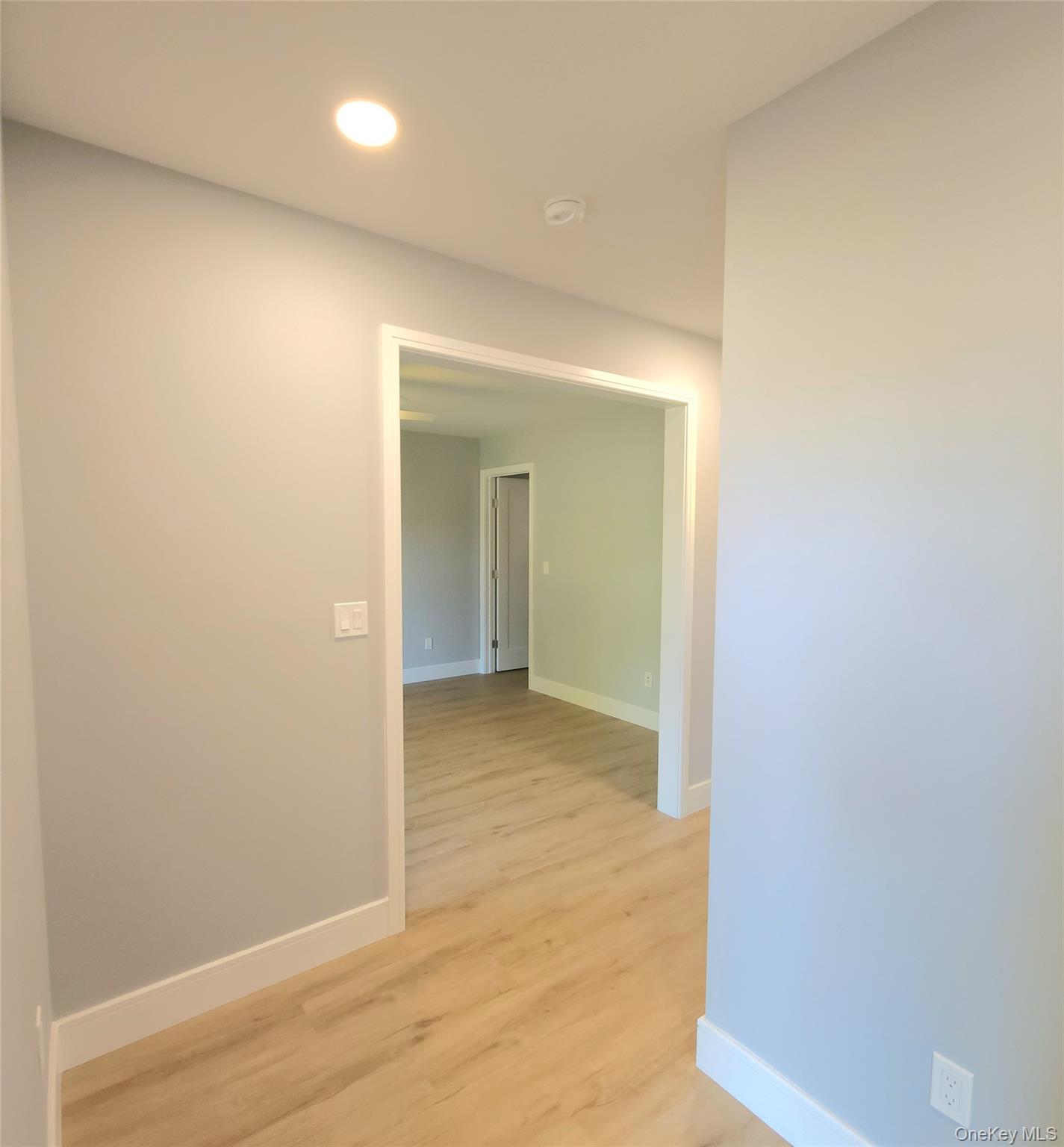 15 Greising Street Pine Bush, NY 12566 - Photo 14 of 22 a view of hallway with wooden floor
