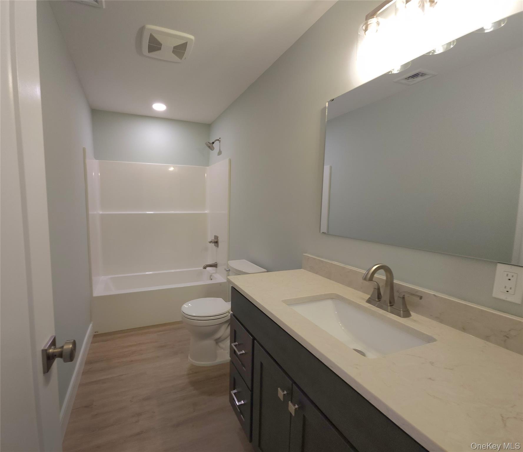 15 Greising Street Pine Bush, NY 12566 - Photo 17 of 22 a bathroom with a sink a toilet and shower