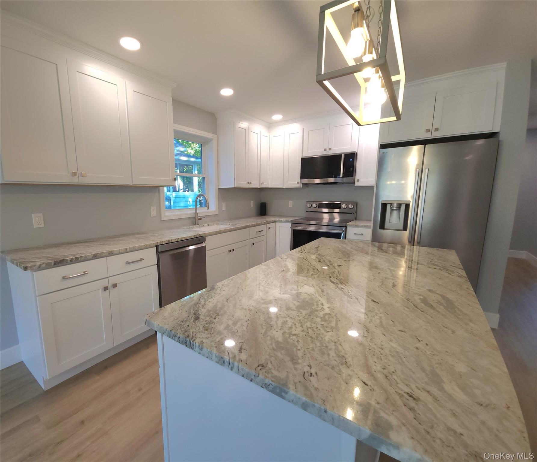 15 Greising Street Pine Bush, NY 12566 - Photo 5 of 22 a kitchen with stainless steel appliances a refrigerator sink and microwave