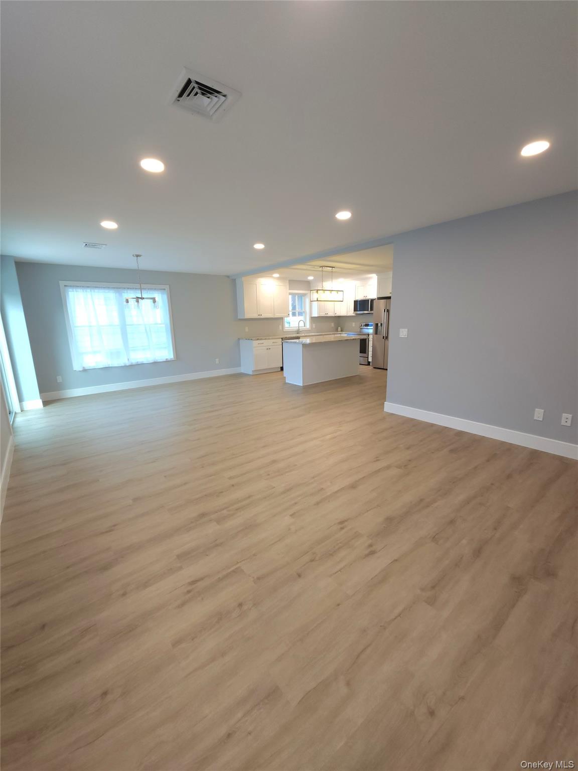 15 Greising Street Pine Bush, NY 12566 - Photo 7 of 22 a view of an empty room with window and cabinet