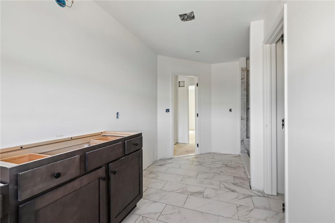 3237 Michaels School Road, Unit 9 Nazareth, PA 18064 - Photo 23 of 56 Polished tile flooring anchors this master bathroom currently under construction.