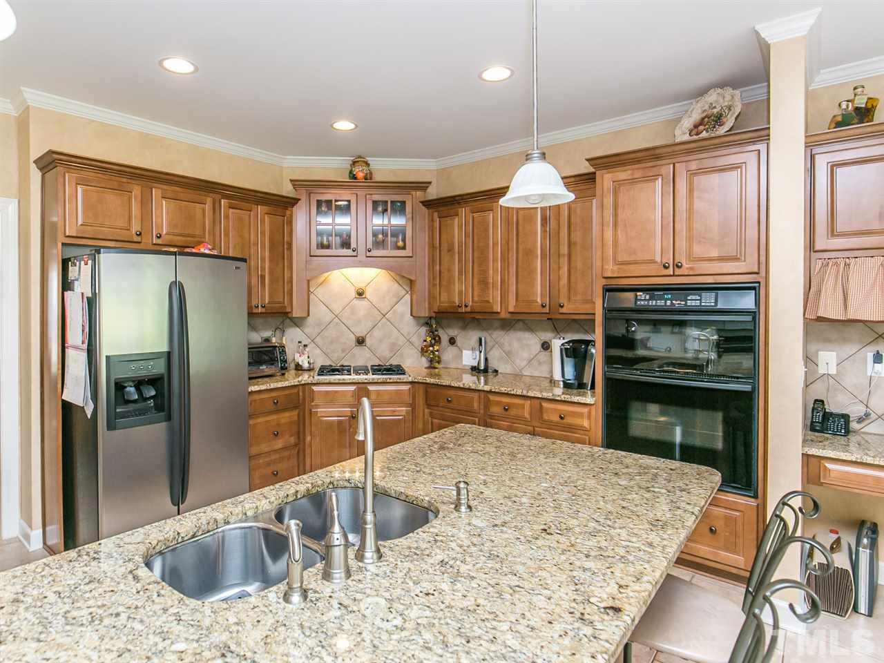 12221 Dunard Street Raleigh, NC 27614 - Photo 4 of 25 Granite Counters, Tile Backsplash, & Stainless Appliances