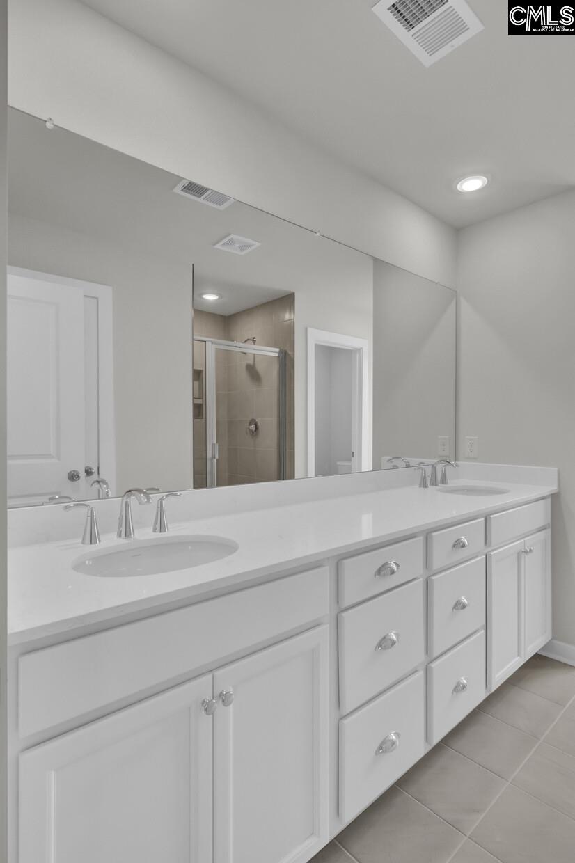 320 Brass Billion Path Lexington, SC 29073 - Photo 18 of 39 a bathroom with double sink and a mirror