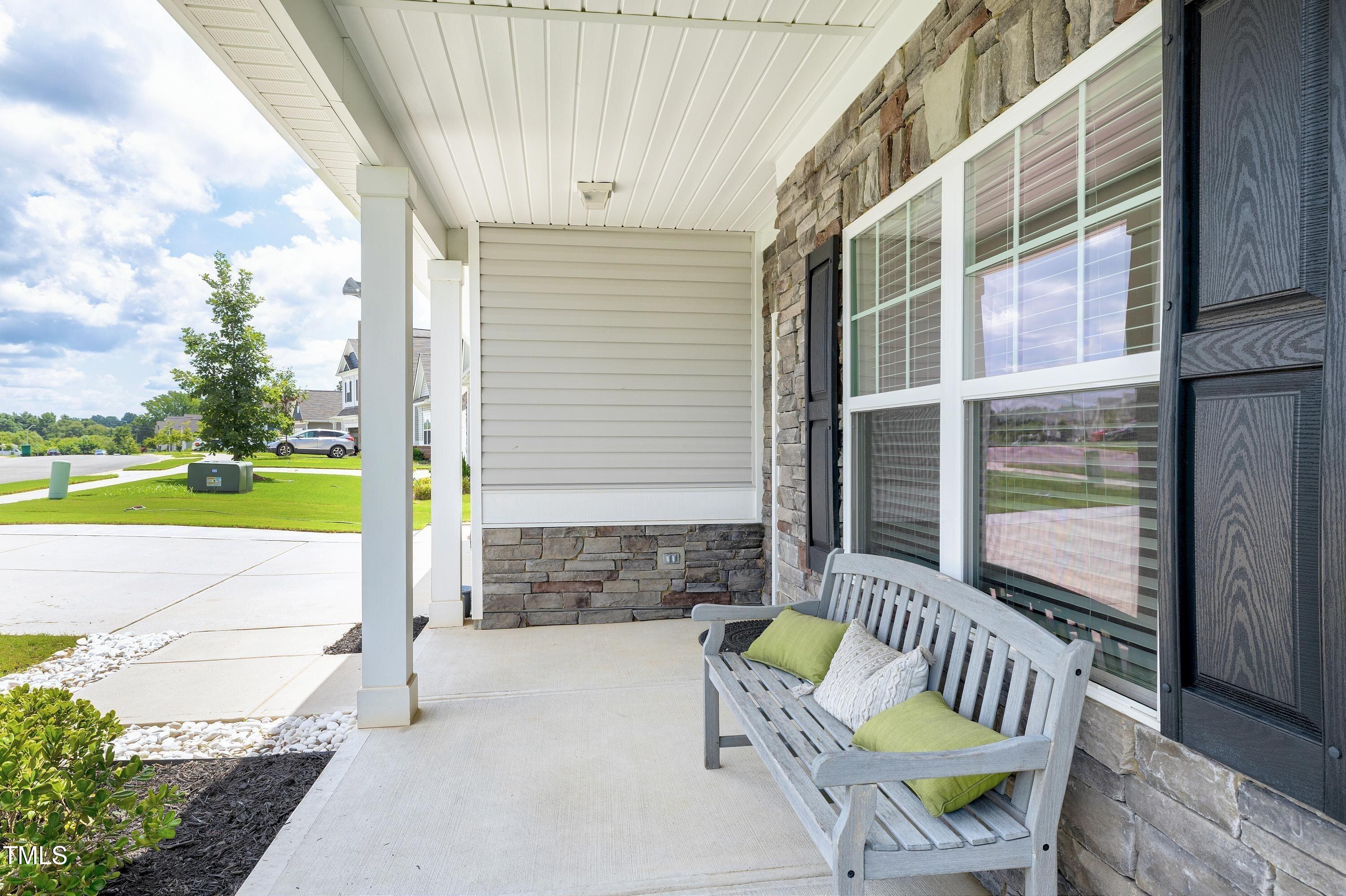 5300 Trilogy Farm Drive Raleigh, NC 27603 - Photo 3 of 50 a view of balcony with two chairs and a table