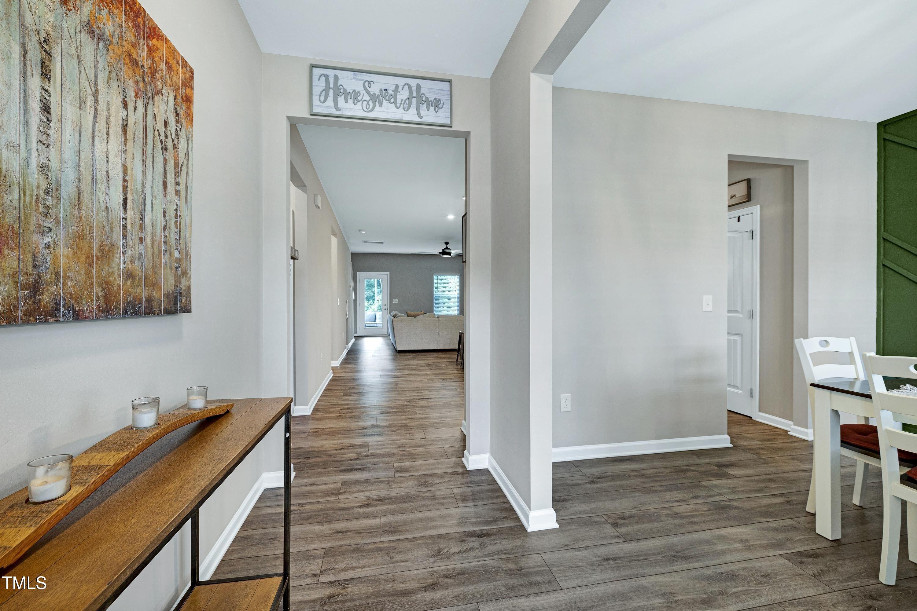 5300 Trilogy Farm Drive Raleigh, NC 27603 - Photo 4 of 50 a view of a hallway with wooden floor