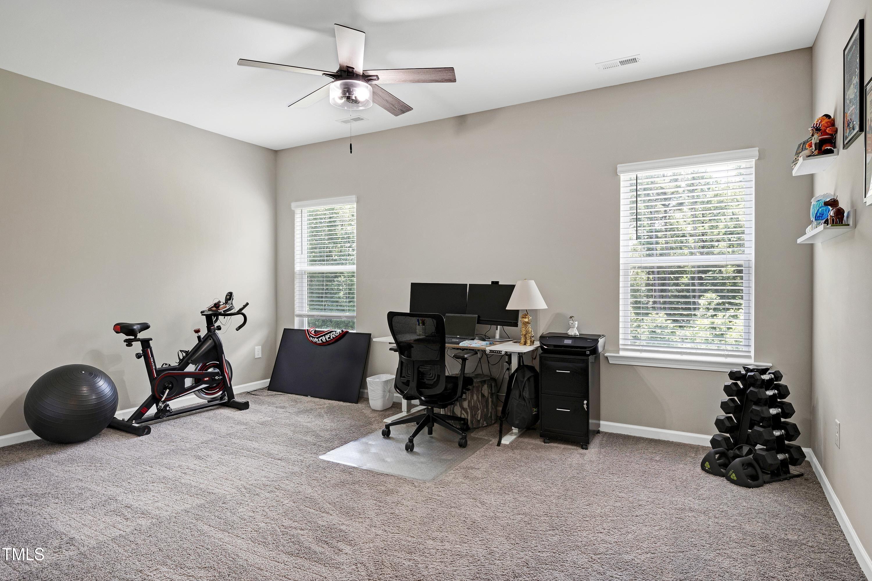 5300 Trilogy Farm Drive Raleigh, NC 27603 - Photo 42 of 50 a livingroom with workspace a window and a couch