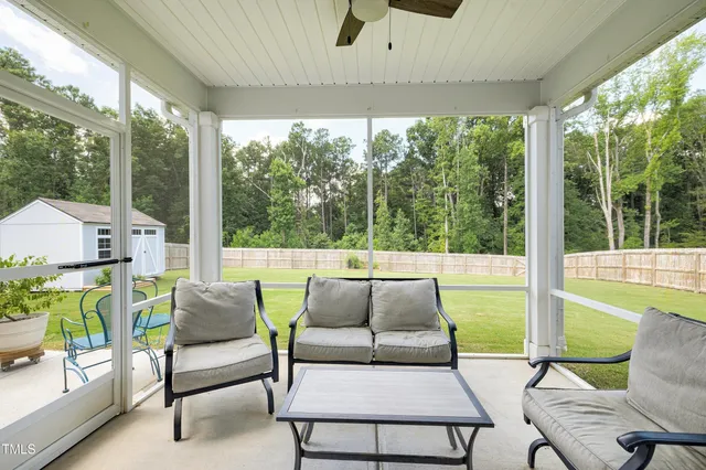 a balcony with furniture and wooden floor