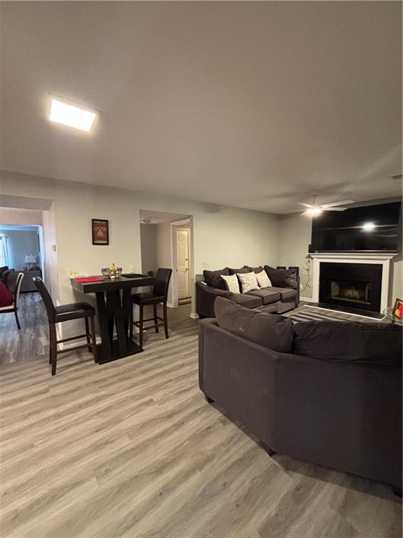 4949 Penscot Way Stone Mountain, GA 30088 - Photo 11 of 40 a living room with furniture and a wooden floor