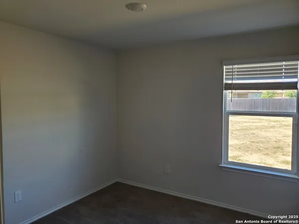 a white toilet sitting next to a bath tub