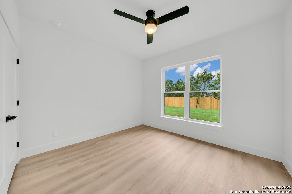 661 Jonquil Drive Spring Branch, TX 78070 - Photo 13 of 18 an empty room with a window