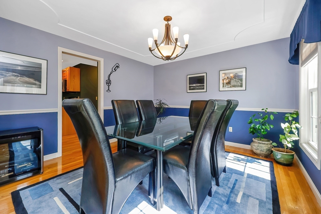 30 Bernardo Drive Attleboro, MA 02703 - Photo 14 of 37 a view of a dining room with furniture a chandelier and wooden floor