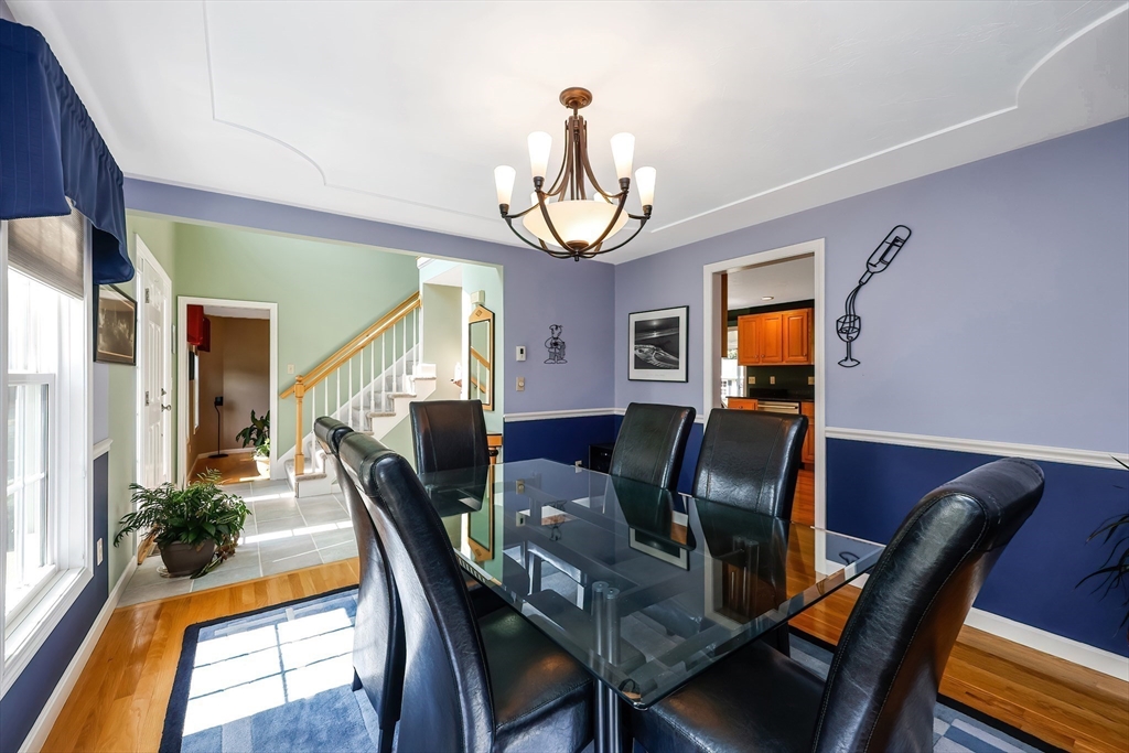 30 Bernardo Drive Attleboro, MA 02703 - Photo 15 of 37 a view of a dining room with furniture a potted plant and wooden floor