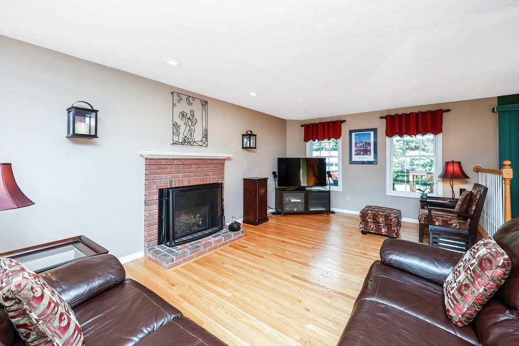 30 Bernardo Drive Attleboro, MA 02703 - Photo 20 of 37 a living room with furniture flat screen tv and a fireplace