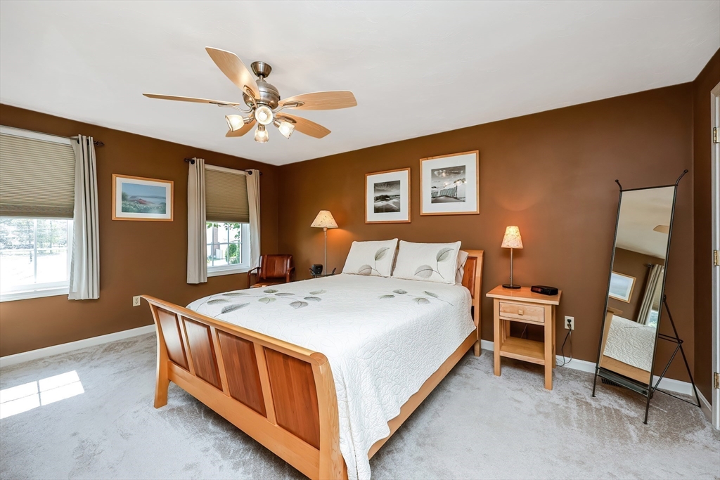 30 Bernardo Drive Attleboro, MA 02703 - Photo 23 of 37 a spacious bedroom with a bed and a chandelier