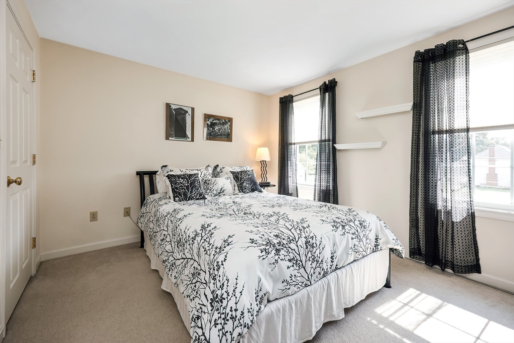 30 Bernardo Drive Attleboro, MA 02703 - Photo 27 of 37 a bedroom with a large bed and a window