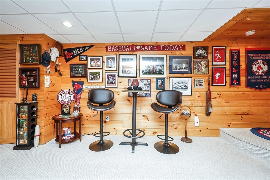 30 Bernardo Drive Attleboro, MA 02703 - Photo 32 of 37 a table room with fireplace and gym equipment