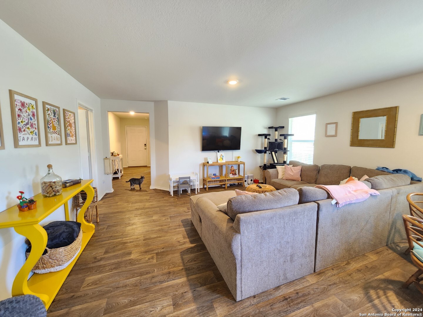 6619 Dynamic Sound San Antonio, TX 78252 - Photo 11 of 20 a living room with furniture and a flat screen tv