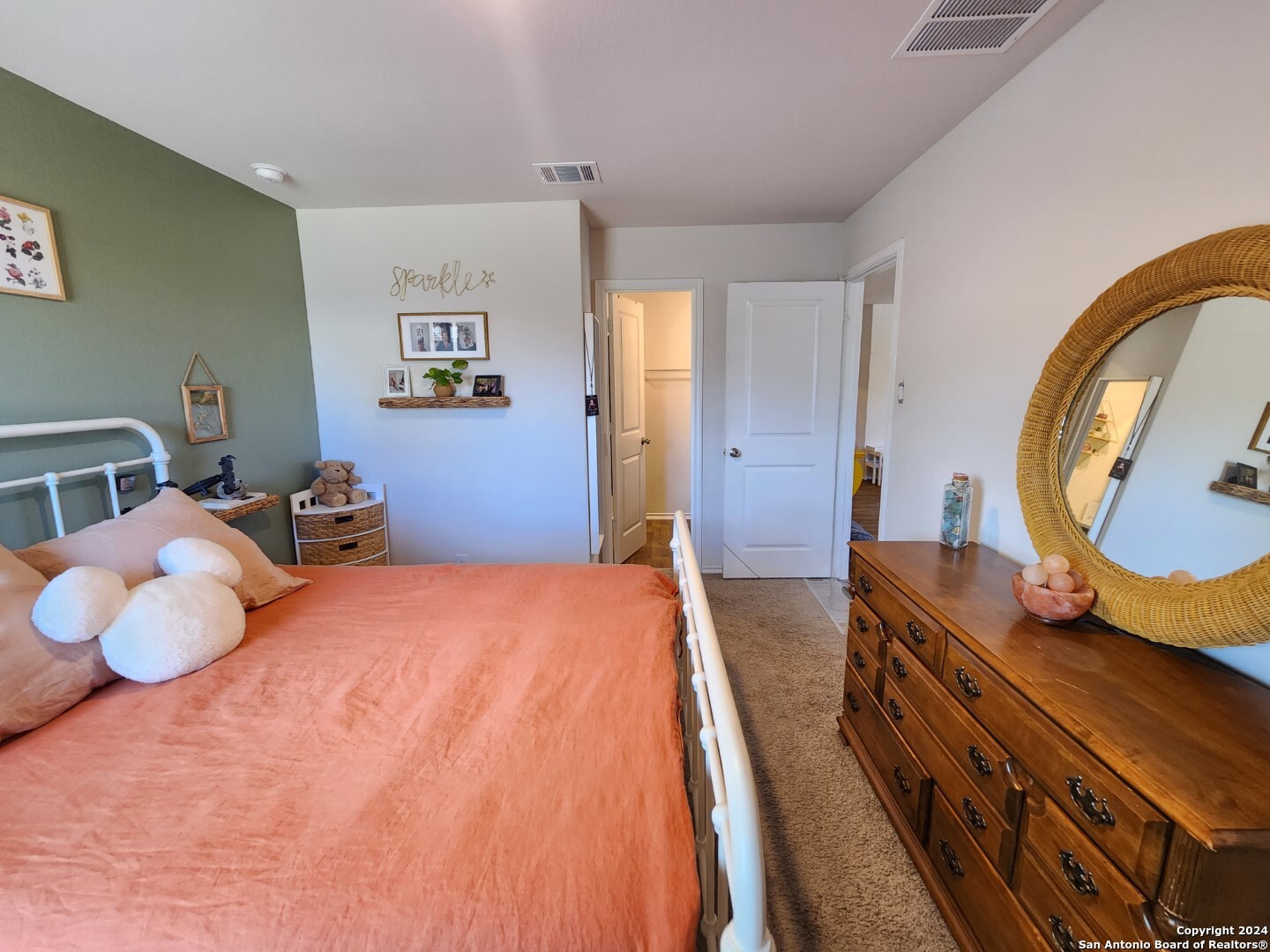 6619 Dynamic Sound San Antonio, TX 78252 - Photo 16 of 20 a bedroom with a large bed and a chandelier