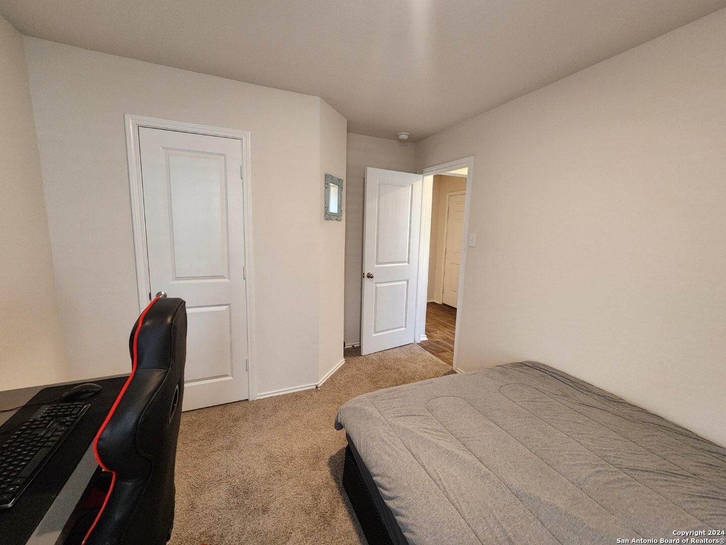 6619 Dynamic Sound San Antonio, TX 78252 - Photo 7 of 20 a bedroom with a bed and a chair