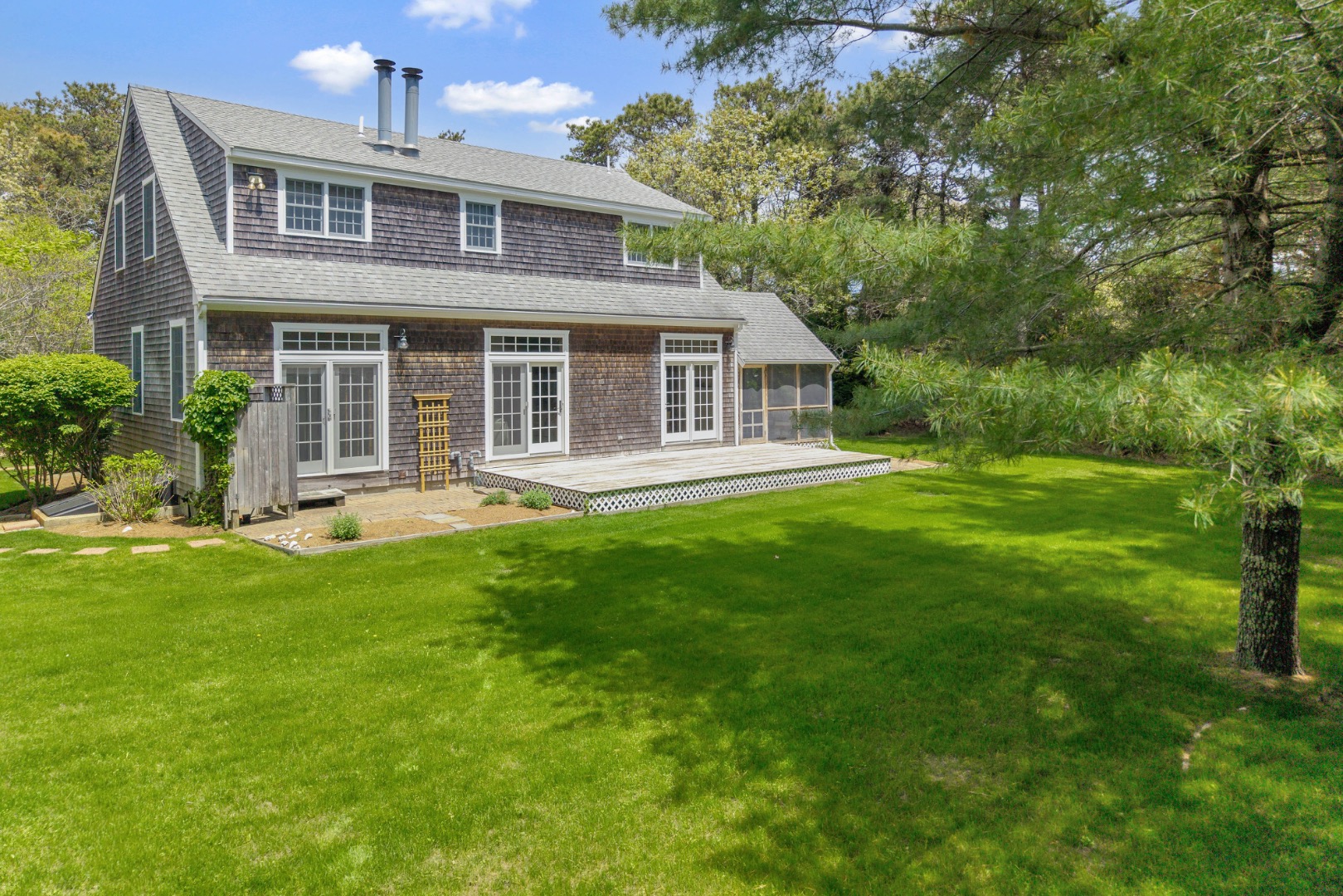 2 Cosmos Way Edgartown, MA 02539 - Photo 29 of 29 a front view of a house with a yard