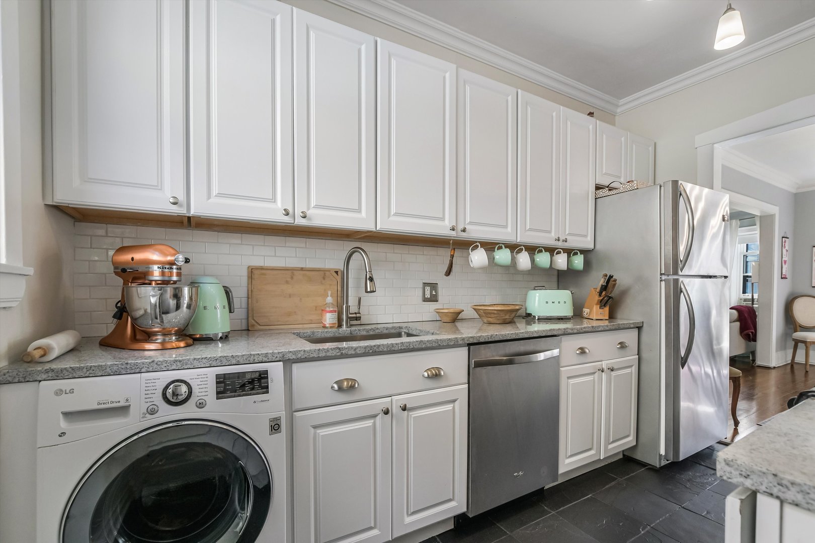 832 Michigan Avenue, Unit 3G Evanston, IL 60202 - Photo 8 of 24 a kitchen with stainless steel appliances granite countertop white cabinets and refrigerator