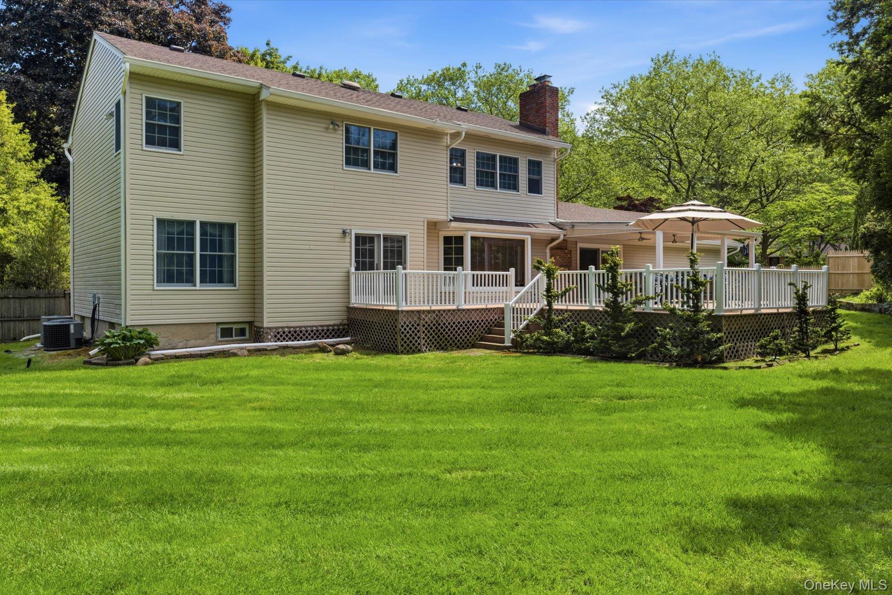6 Brandy Road Cold Spring Harbor, NY 11724 - Photo 21 of 25 a front view of house with yard and green space