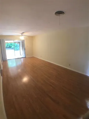 en empty room with windows and closet