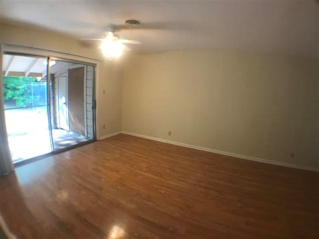 2310 Rebel Road, Unit B Austin, TX 78704 - Photo 4 of 13 wooden floor in an empty room with a window