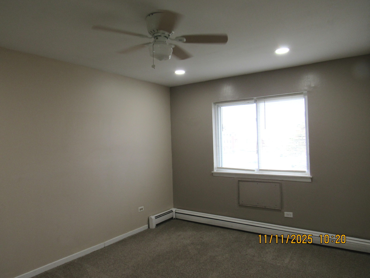 1156 Copperfield Lane, Unit E Schaumburg, IL 60193 - Photo 11 of 13 an empty room with a window
