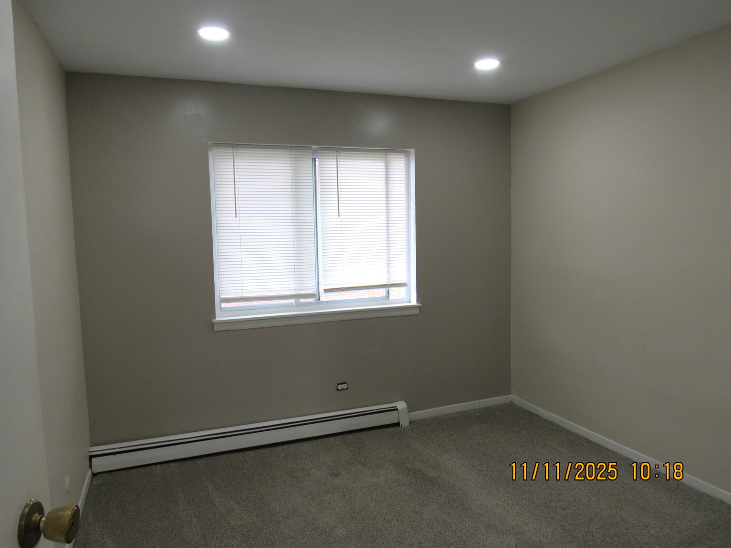 1156 Copperfield Lane, Unit E Schaumburg, IL 60193 - Photo 13 of 13 an empty room with a window