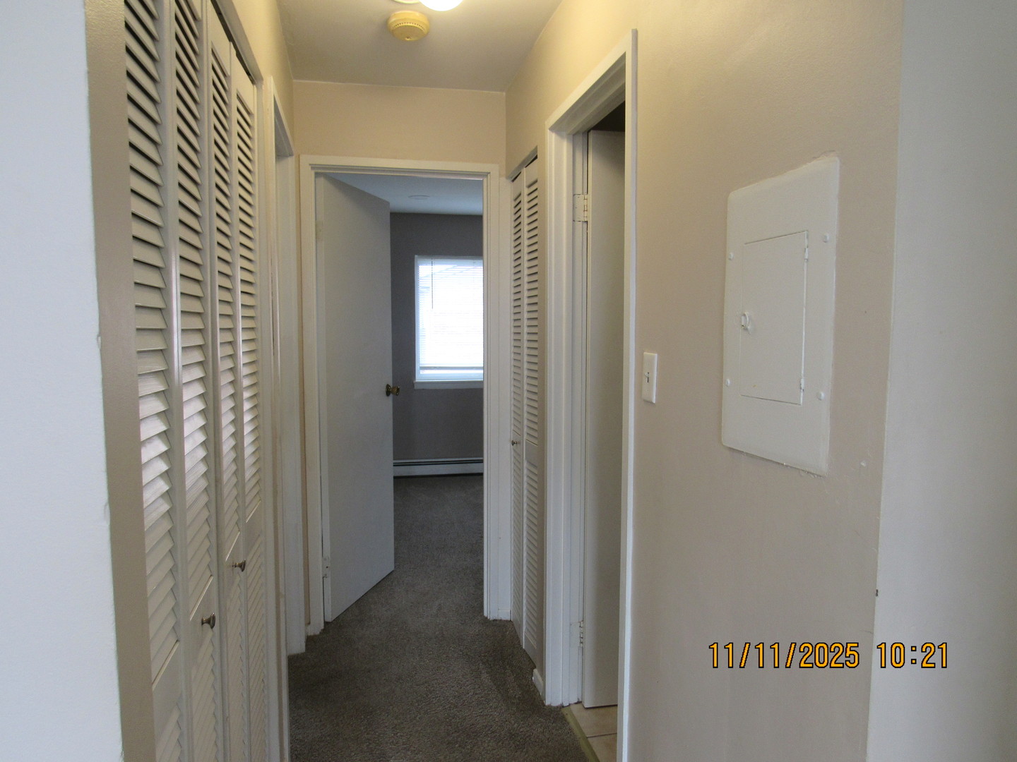 1156 Copperfield Lane, Unit E Schaumburg, IL 60193 - Photo 8 of 13 a view of a bathroom from a hallway