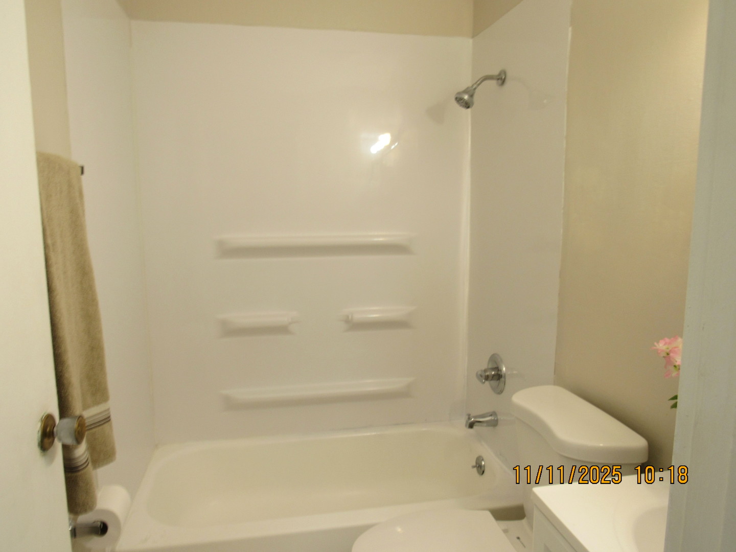 1156 Copperfield Lane, Unit E Schaumburg, IL 60193 - Photo 9 of 13 a bathroom with a tub and a shower