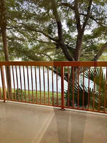 a view of an ocean with trees