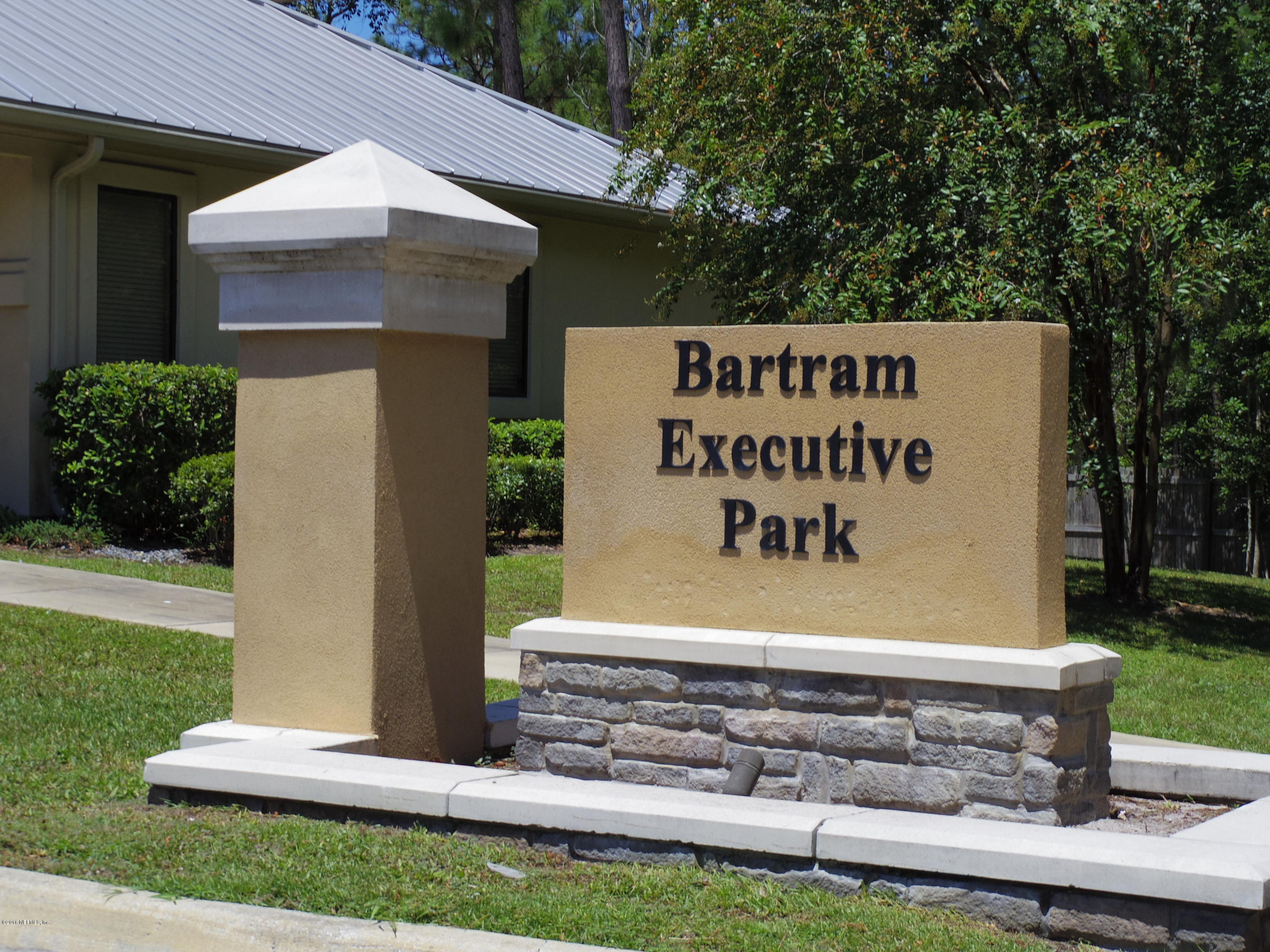 1633 Race Track Road, Unit 104 St. Johns, FL 32259 - Photo 2 of 12 a sign on the side of a building