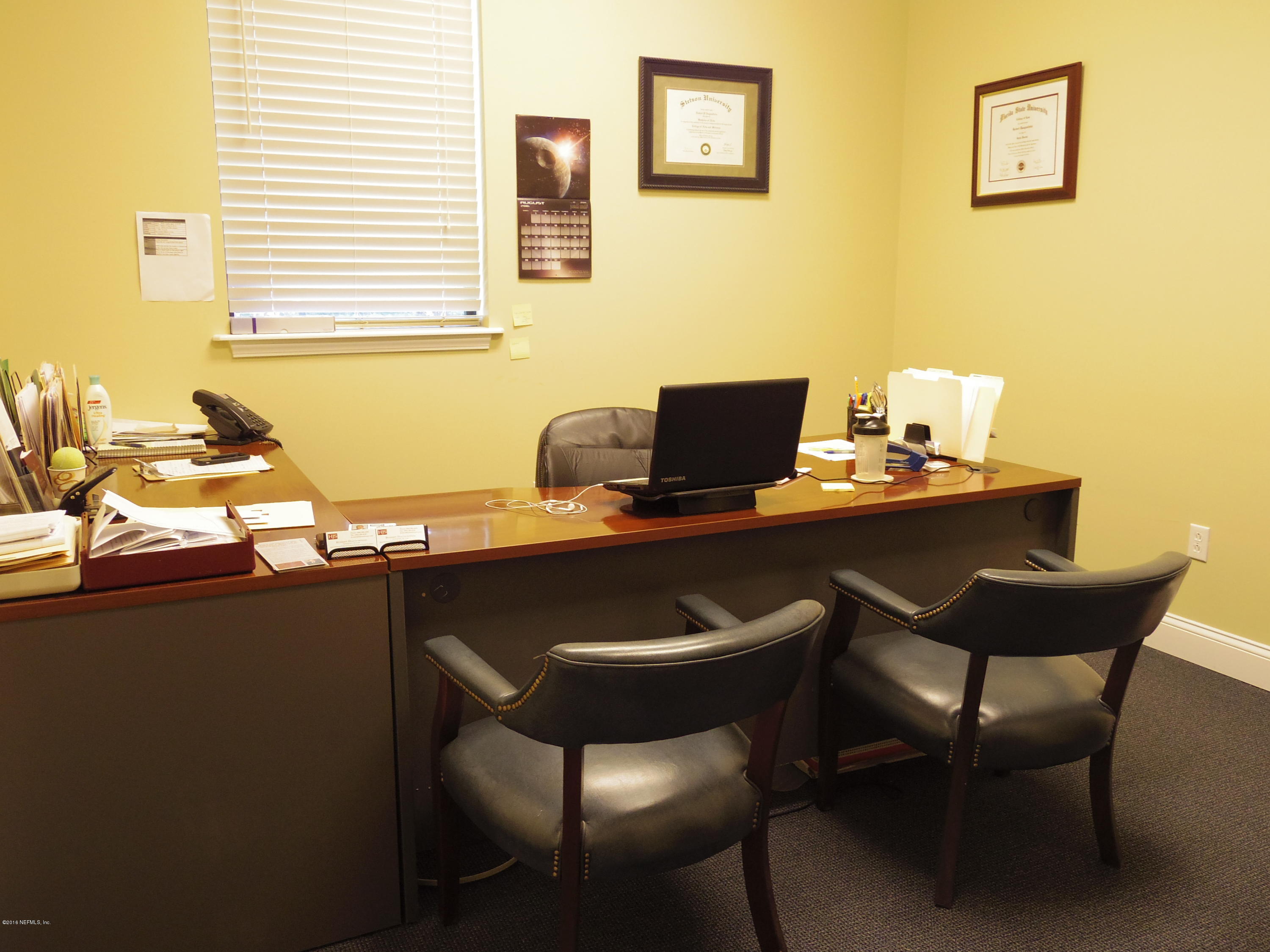 1633 Race Track Road, Unit 104 St. Johns, FL 32259 - Photo 8 of 12 a table and chairs in a room